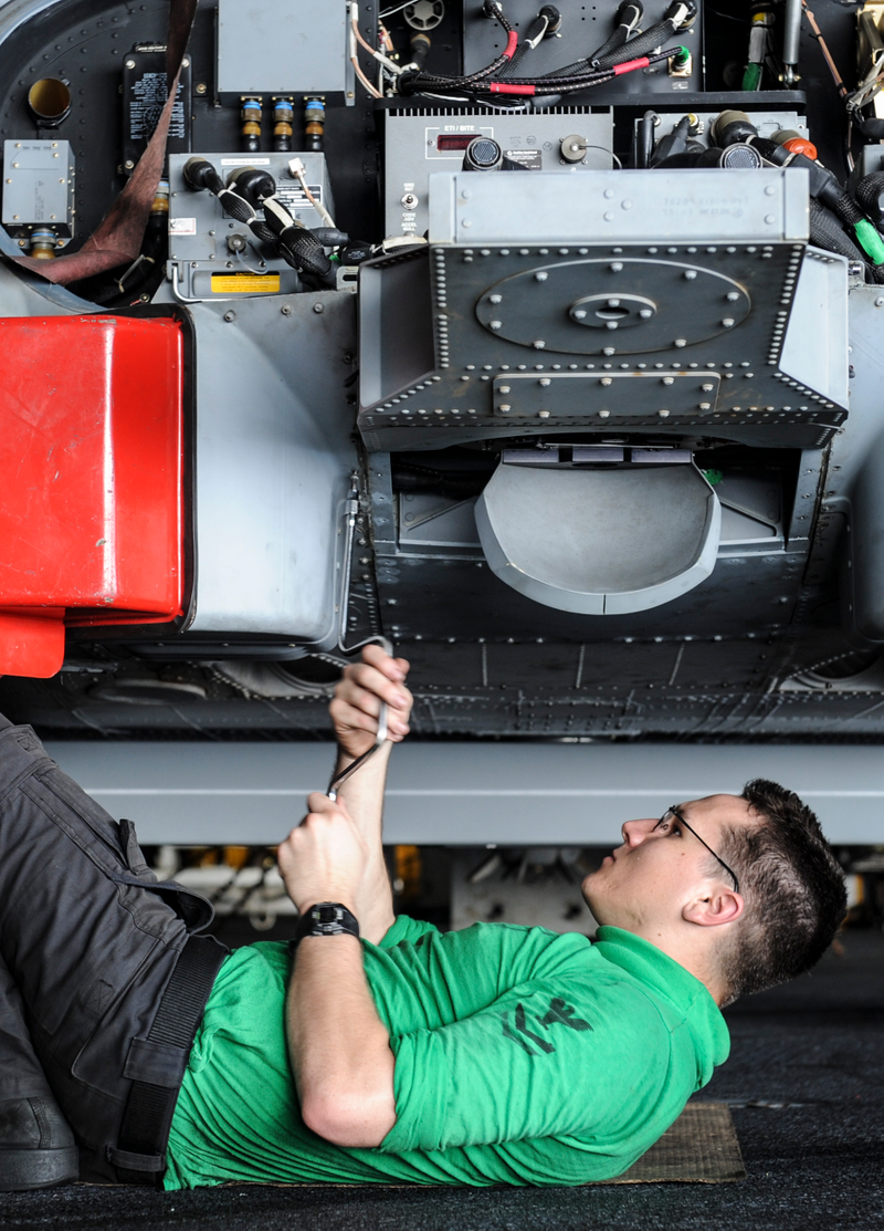 Reinstalling equipment on a SH-60 Seahawk